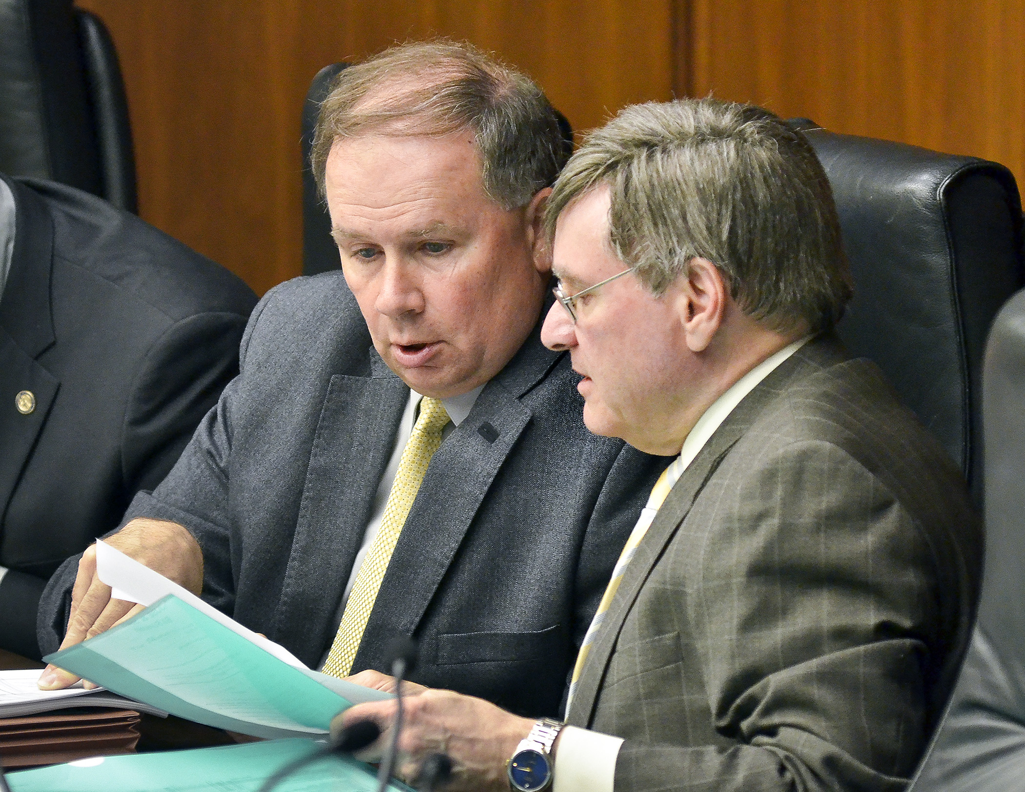 House Ways and Means Committee Chair Jim Knoblach, left, and Sen. Dick Cohen, chairman of the Senate Finance Committee, confer during a joint informational hearing June 11 on the omnibus jobs and energy bill. Photo by Andrew VonBank