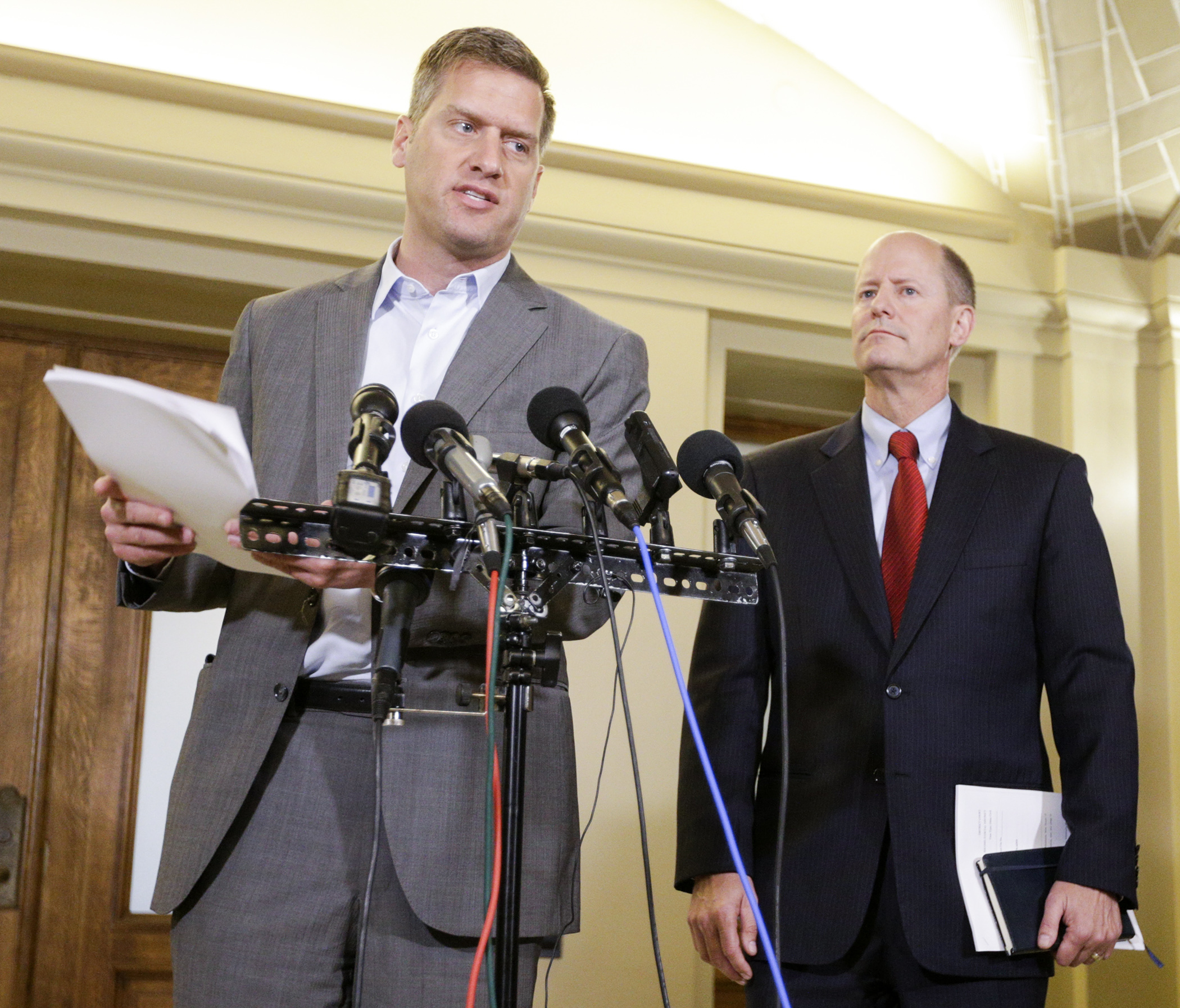 House Speaker Kurt Daudt holds a copy of the court papers he said would be filed Tuesday in the Legislature’s dispute with Gov. Mark Dayton over his line-item veto of House and Senate funding. Photo by Paul Battaglia