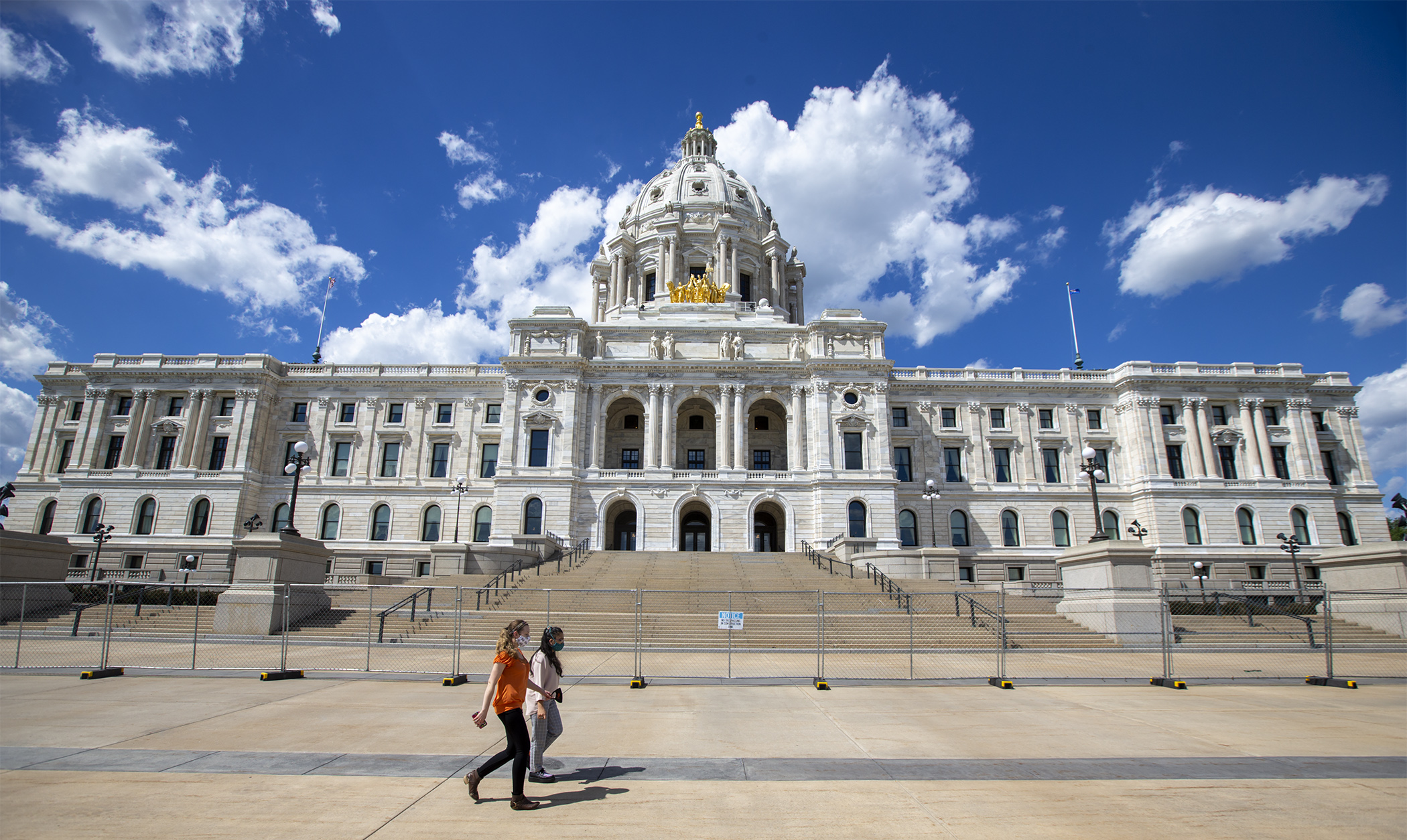 Increased security at the State Capitol, pictured here surrounded by a security fence in June 2020, is part of Gov. Tim Walz's proposed transportation budget. Photo by Paul Battaglia
