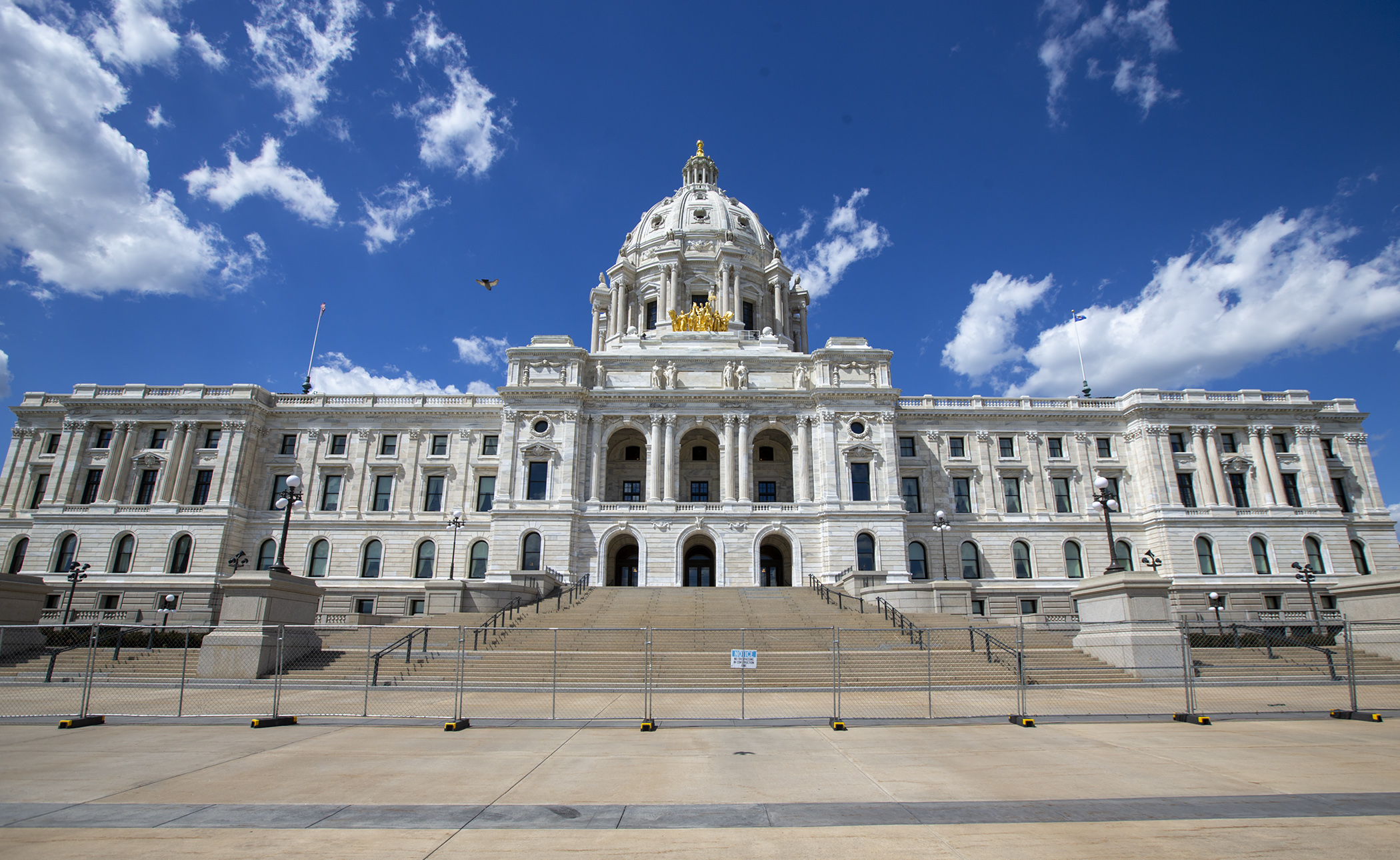 Visitors walk past the State Capitol June 16. Photo by Paul Battaglia