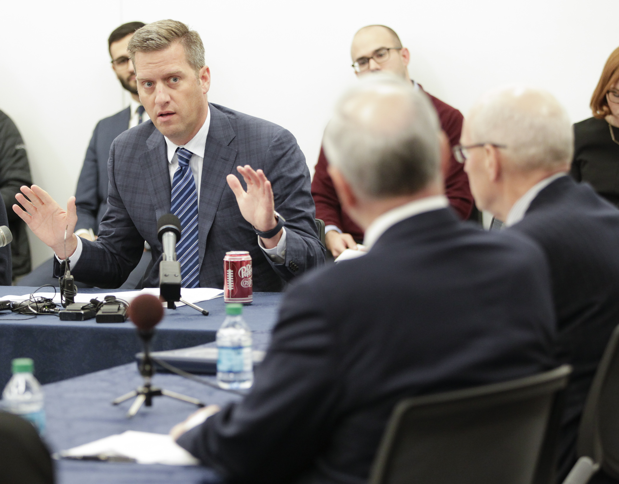 House Speaker Kurt Daudt, left, and Gov. Mark Dayton, center right, have a tense public meeting to try to negotiate a compromise for a special session to fix the health care cost crisis Dec. 16. Photo by Paul Battaglia