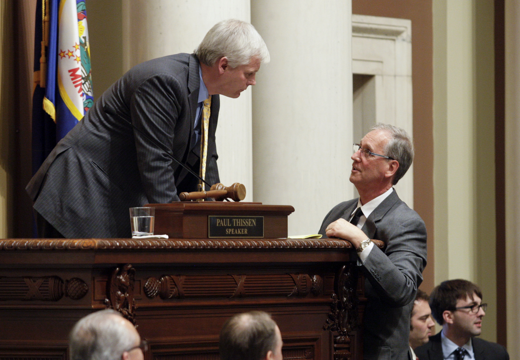 House Speaker Paul Thissen, left, and Chief Clerk Al Mathiowetz confer during the 2014 legislative session. House Photography file photo