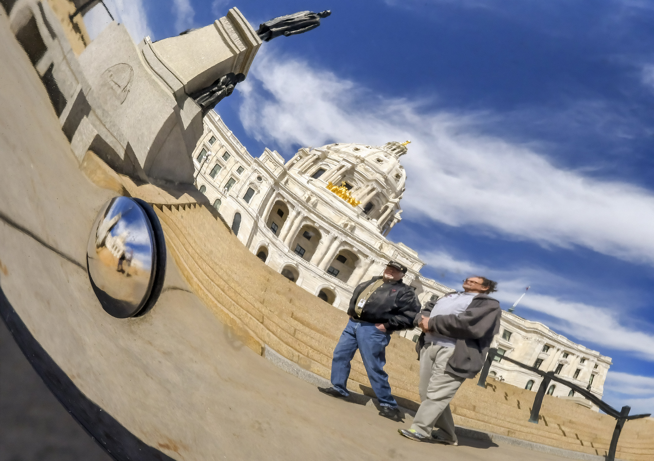 Visitors to the Capitol cross a sunny corridor Jan. 29 while temperatures outside hovered double-digits below zero. Photo by Andrew VonBank