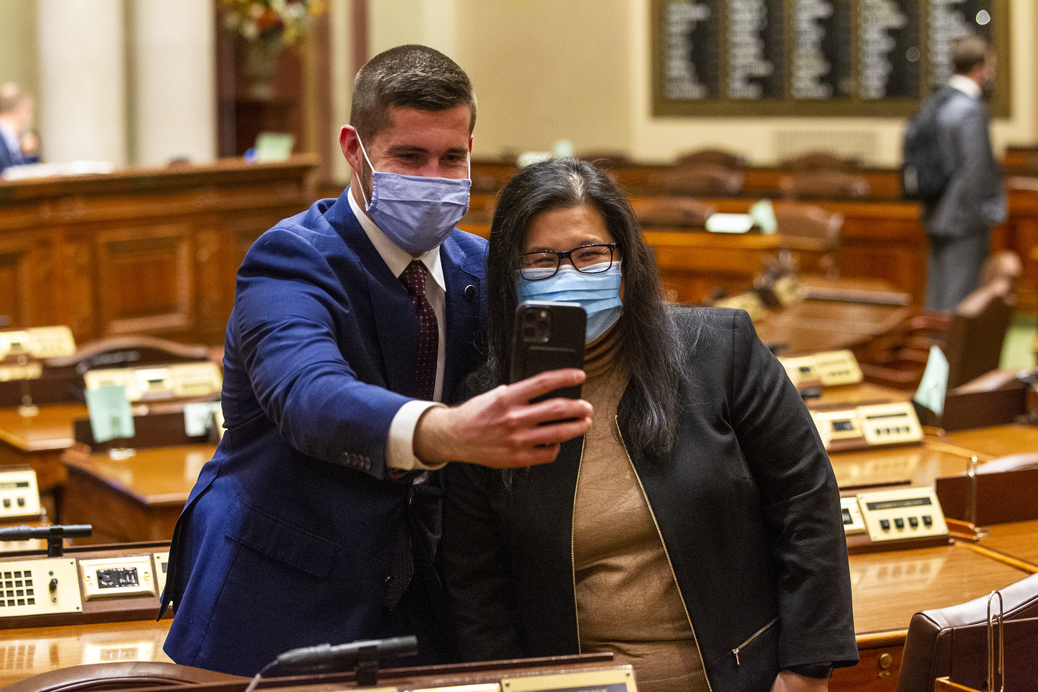 Rep. Dan Wolgamott and Rep. Kaohly Her take a selfie at the conclusion of the House Floor session on opening day of the 2021 session Jan. 5 Photo by Paul Battaglia